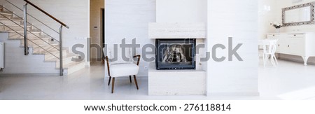 Fireplace in the open space inside the apartment, panorama