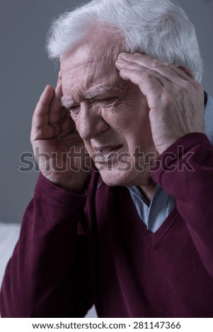 Elderly men having horrible migraine