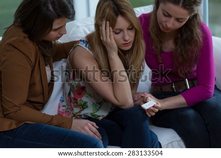 Three girl friends trying to solve a difficult pregnancy problem