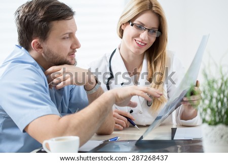 Younger doctor asks his older colleague for advice
