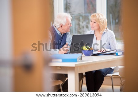 Elder people having conversation in their home office