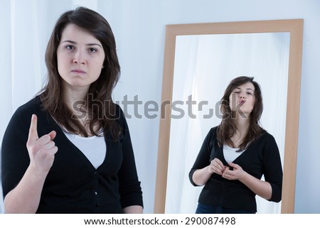 Horizontal view of angry girl shaking finger