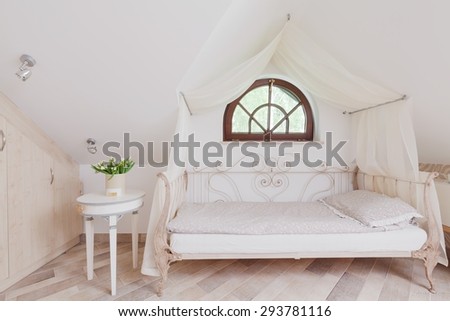 Stylish bed with canopy in romantic bedroom
