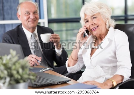 Photo of pair of mature entrepreneurs at work