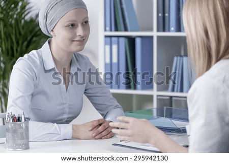 Young pale woman with cancer at doctor\'s office