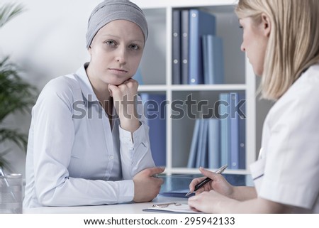 Photo of young pale cancer woman with scarf on head