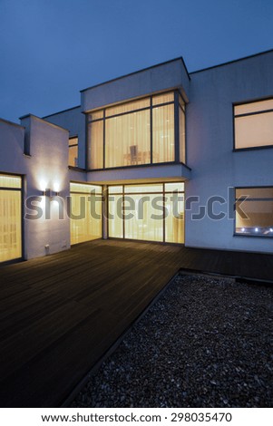 Illuminated windows in detached house - picture done at night