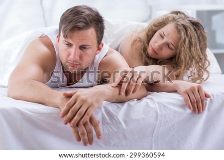 Photo of attractive wife trying to make up with husband