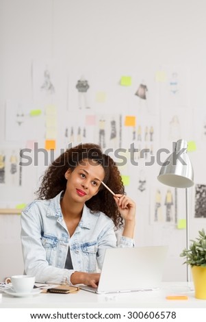 Image of female creative worker thinking about new project