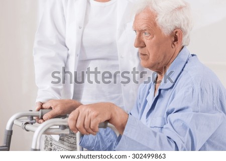 Close up of sad elderly patient with walking problem