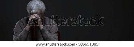 Despair elder man holding walking stick - panorama