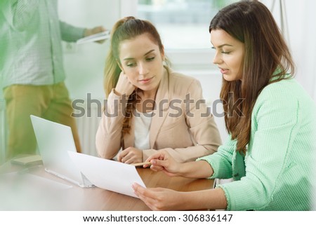 Female graphic designers sitting at the desk