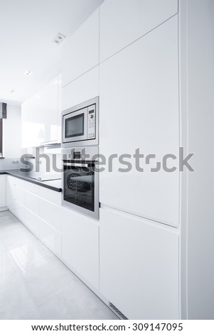 Close-up of white kitchen unit in modern house