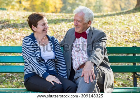 Portrait of senior couple laughing in park