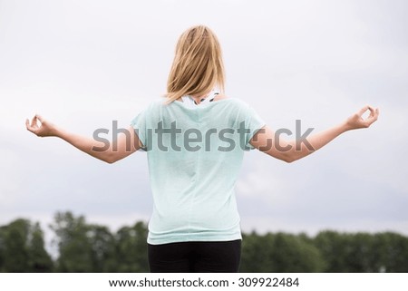 Photo of healthy woman celebrating summer in nature