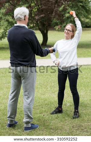 Photo of mature athletic pair during outdoor physical activity