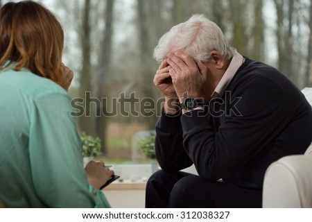 Image of despair elder man during psychological therapy