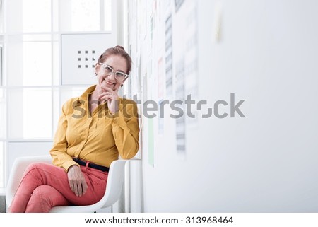 Picture of female executive director sitting in office chair