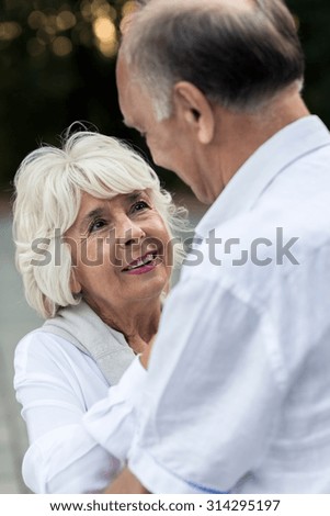 Older couple in love looking each other eyes