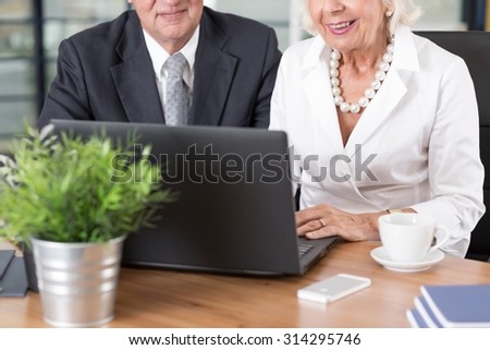 Elder smart business people know how to use computer