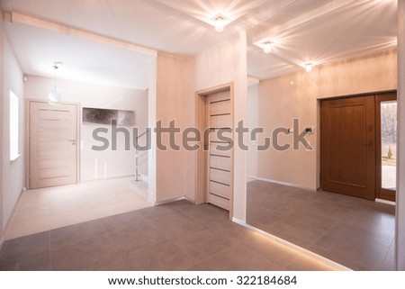 Picture of entrance hall and light corridor in stylish apartment