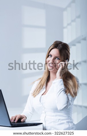 Female office worker talking on the phone