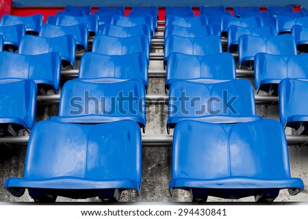 Blue seats on the stadium. Seat for watch some sport or football.