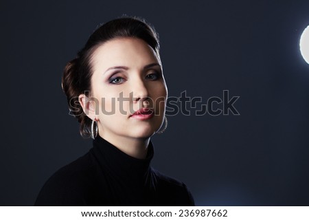 artistic portrait, of the beautiful woman, on the dark background
