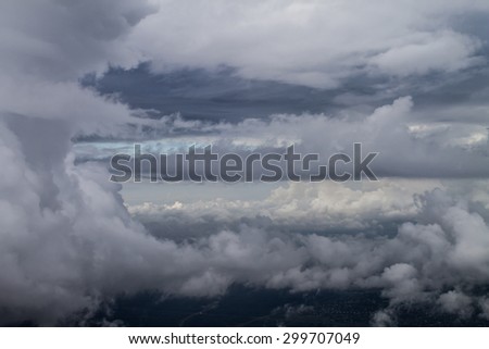 view of storm clouds from airplane window
