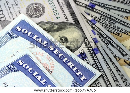 Social security card and US currency - Retirement Concept Social Security Benefits