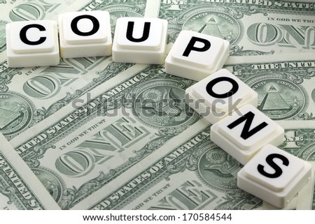 The word coupons on US currency background - A term used in futures and options trading
