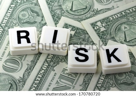The word risk on US currency background - A term used in futures and options trading