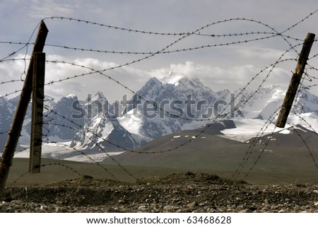 barbed wire wall in the mountains