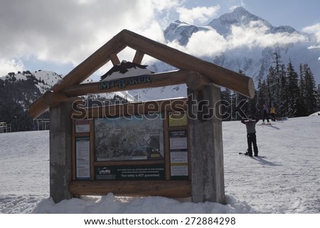 MT BAKER, WASHINGTON/USA - April 12 2012: Mt Baker Ski Area White Salmon Base Sign with Mt Shuksan in the Background During A Sunny Spring Day of Operations