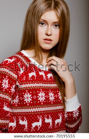 Woman to the waist with big eyes in a sweater