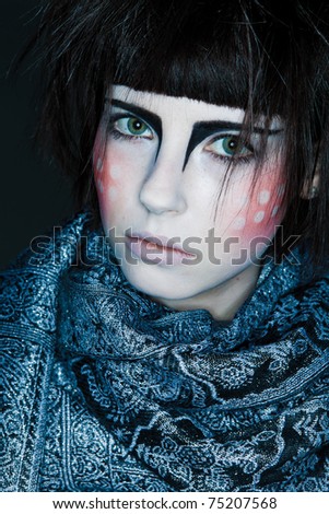 girl with an unusual makeup and a scarf