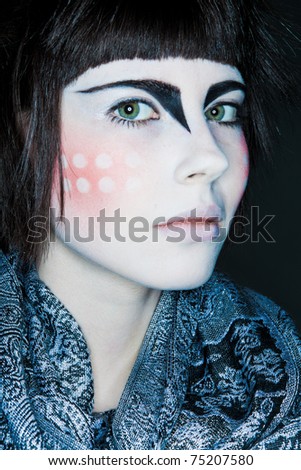 girl with an unusual makeup and a scarf