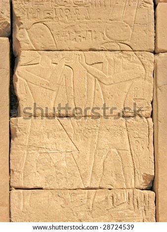 Pharaoh Ramses and the sun god Ra. Relief in the Temple of Amun-Ra at Karnak. Luxor, Egypt.