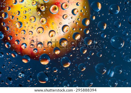 Photo apple in drops of water. can put or montage your product for display apple in water. Focus on water drops in the middle