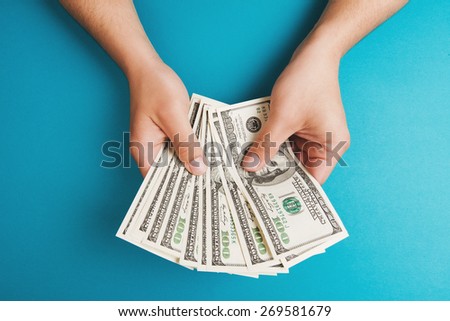 Man counting money, economy concept, allocation of money