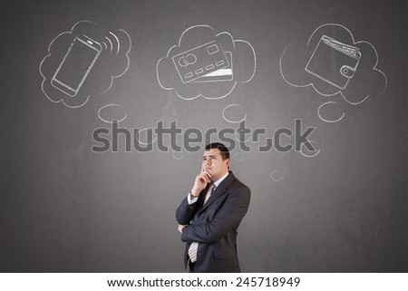 Young and handsome businessman choosing a payment method between smartphone, credit or debit card and money (cash)