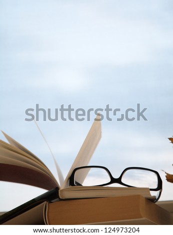 image of open book and glasses