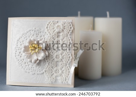 handmade cards and three white candles