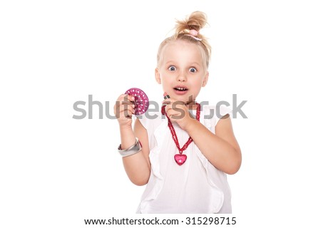 Little girl in fashionable clothes blond with a mirror and lipstick on a white space for writing