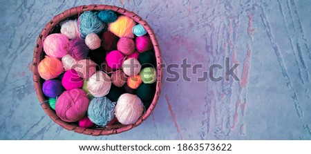 Colorful balls of wool thread in the basket on the floor Stok fotoğraf © 