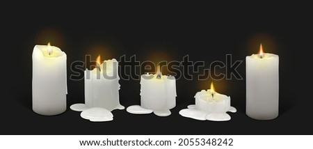 Set of realistic burning white candles on a black background. 3d candles with melting wax, flame and halo of light. Vector illustration with mesh gradients. EPS10.