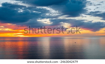 Similar – Image, Stock Photo sunset on the coast of the lake. Natural landscape. reflection, night city illumination, blue sky and yellow sunlight. landscape during sunset.