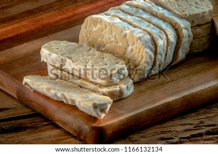 slices of tempe on the wooden table Photo stock © 