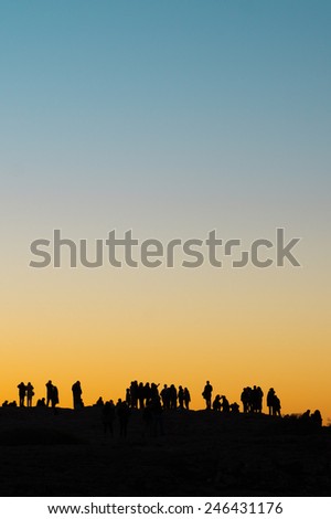 Silhouettes of Tourists Enjoying the Sunset at the Cape Saint Vincent in Portugal
