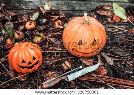 Happy Halloween. Holiday pumpkins and decorations. Pumpkin on autumn street. Preparations for the holiday decoration bats and manufacturing Hallowe\'en pumpkin
